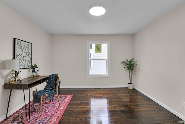 office space with baseboards and hardwood / wood-style flooring