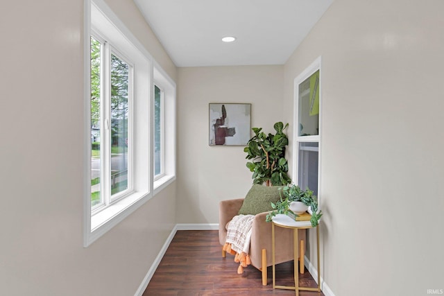 hallway featuring recessed lighting, baseboards, and dark wood-style floors