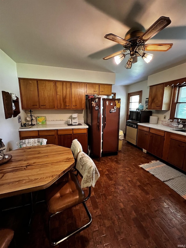 607 Troy Rd, Washington, IN 47501 - kitchen featuring a ceiling fan, black microwave, light countertops, freestanding refrigerator, and dark wood-style floors