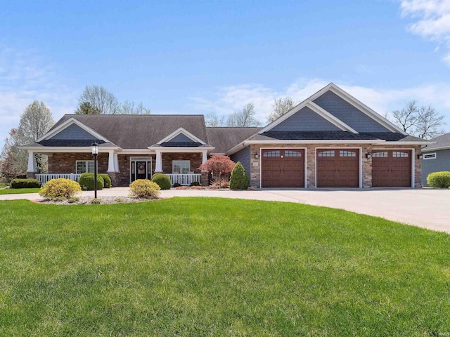 craftsman-style home with an attached garage, covered porch, and a front yard
