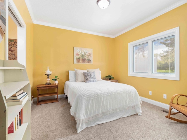 carpeted bedroom with crown molding, baseboards, and visible vents