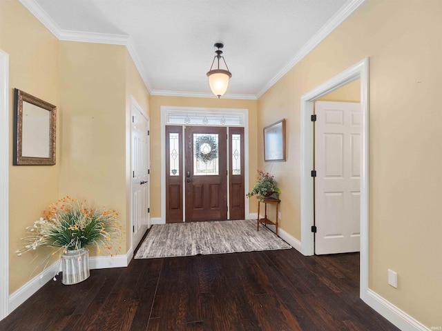 foyer entrance featuring baseboards, crown molding, and wood finished floors