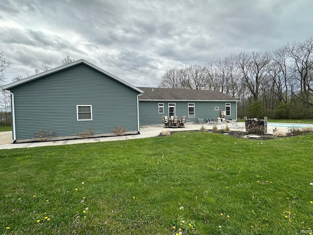 8679 E 850th St, New Carlisle, IN 46552 - rear view of property featuring a patio area, an outdoor pool, and a yard