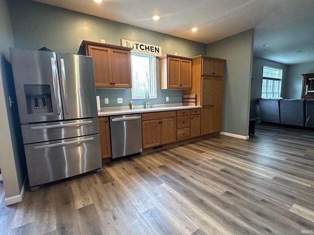 8679 E 850th St, New Carlisle, IN 46552 - kitchen featuring wood finished floors, open floor plan, recessed lighting, light countertops, and stainless steel appliances