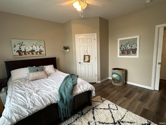 8679 E 850th St, New Carlisle, IN 46552 - bedroom with dark wood-type flooring, baseboards, and ceiling fan