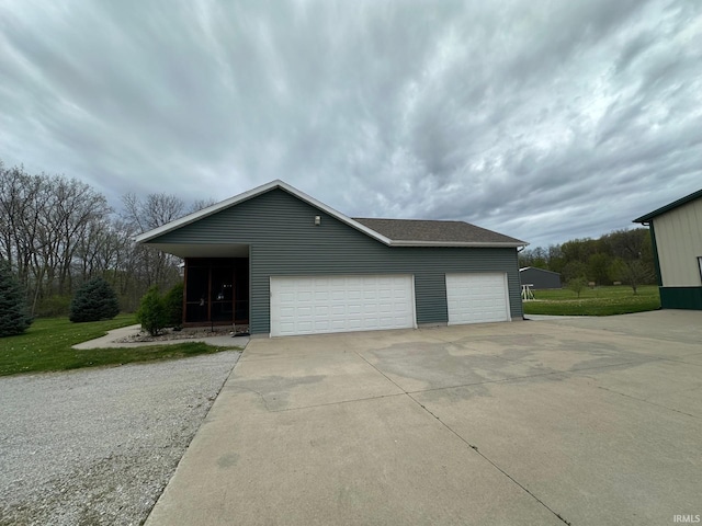 8679 E 850th St, New Carlisle, IN 46552 - view of home's exterior with a garage and driveway