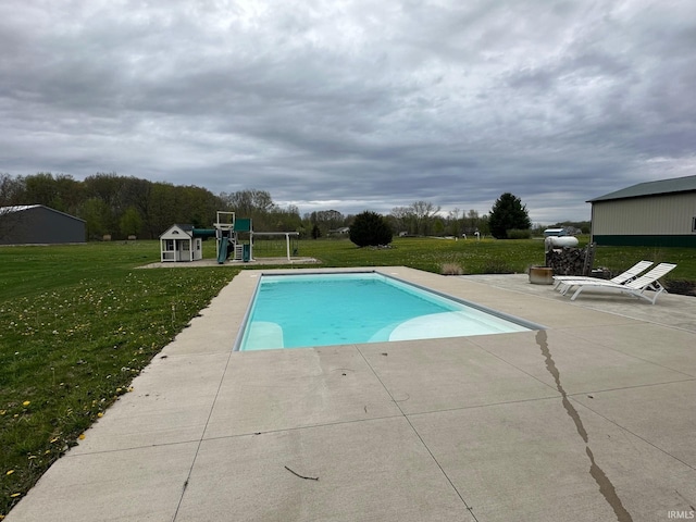 8679 E 850th St, New Carlisle, IN 46552 - outdoor pool featuring a playground, a patio area, and a yard
