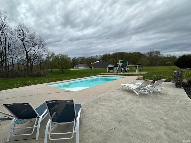 8679 E 850th St, New Carlisle, IN 46552 - pool featuring a yard, a patio area, and a playground