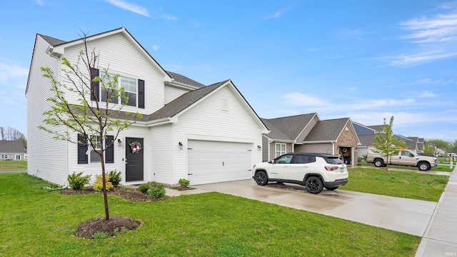 traditional home featuring a garage, driveway, and a front lawn