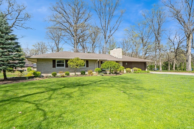 119 Southridge Dr, Fort Wayne, IN 46825 - ranch-style house featuring an attached garage, a front yard, a chimney, and concrete driveway