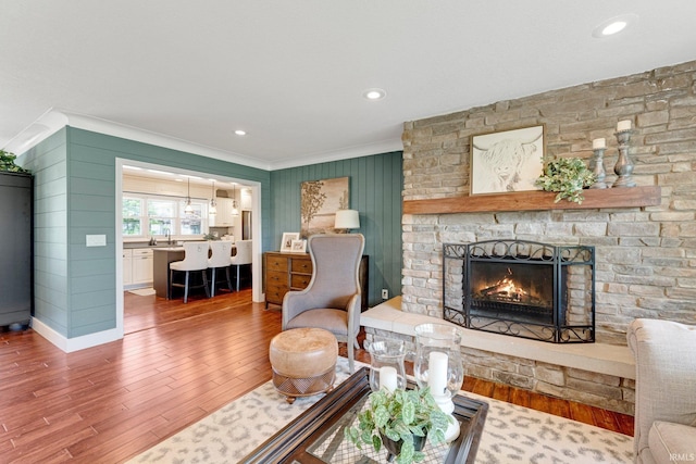 119 Southridge Dr, Fort Wayne, IN 46825 - living area featuring recessed lighting, ornamental molding, wood finished floors, and a fireplace
