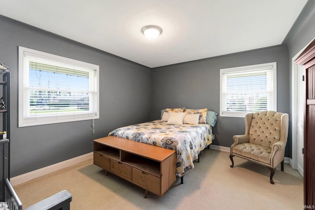 119 Southridge Dr, Fort Wayne, IN 46825 - bedroom with baseboards, light colored carpet, and multiple windows