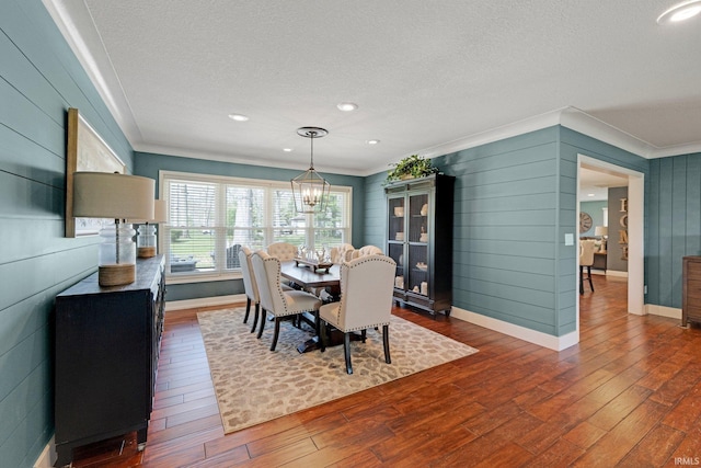 119 Southridge Dr, Fort Wayne, IN 46825 - dining space featuring a textured ceiling, baseboards, dark wood finished floors, and ornamental molding