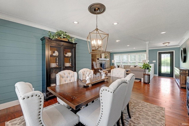 119 Southridge Dr, Fort Wayne, IN 46825 - dining room with wood-type flooring, recessed lighting, a fireplace, and ornamental molding