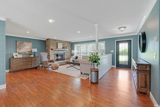 119 Southridge Dr, Fort Wayne, IN 46825 - living area featuring baseboards, crown molding, and a stone fireplace