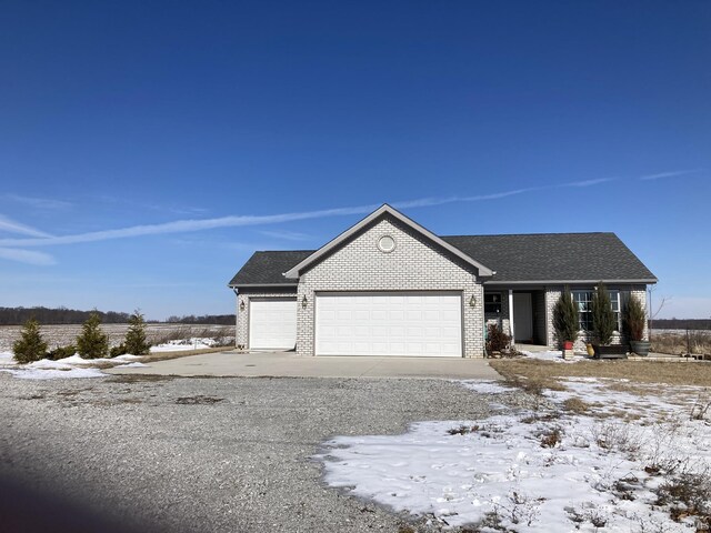 4530 E 700 N, Monterey, IN 46960 - ranch-style house with an attached garage, roof with shingles, driveway, and brick siding