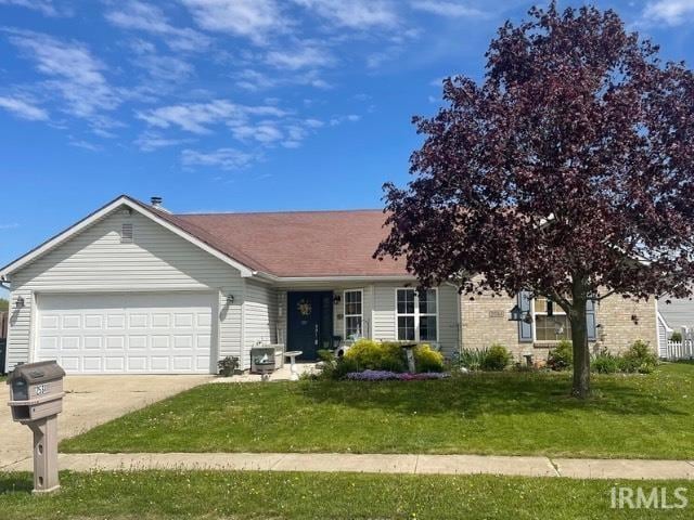 ranch-style home featuring concrete driveway, brick siding, a front yard, and a garage