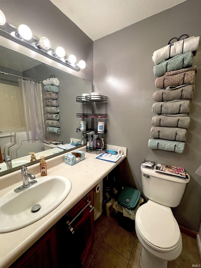 bathroom with vanity, a shower with shower curtain, tile patterned flooring, and toilet
