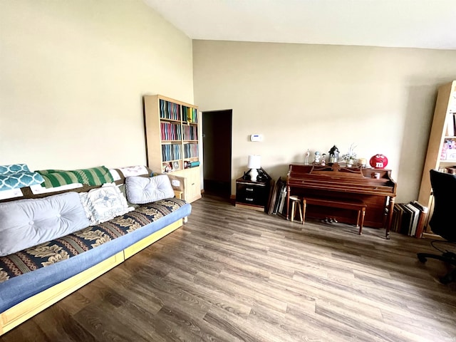 sitting room with wood finished floors and lofted ceiling
