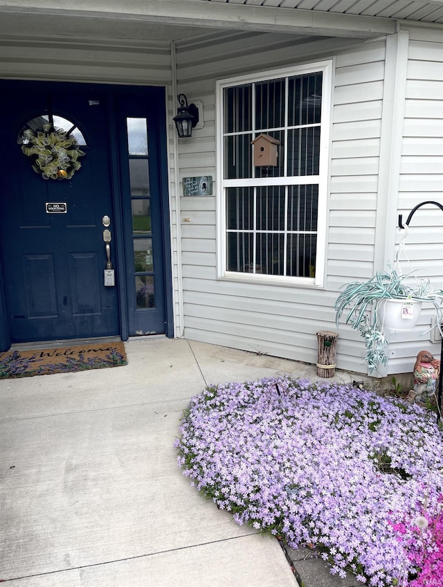 doorway to property featuring a porch