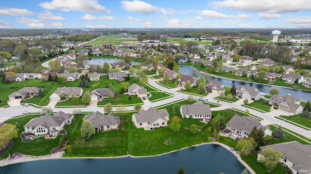 bird's eye view with a water view and a residential view