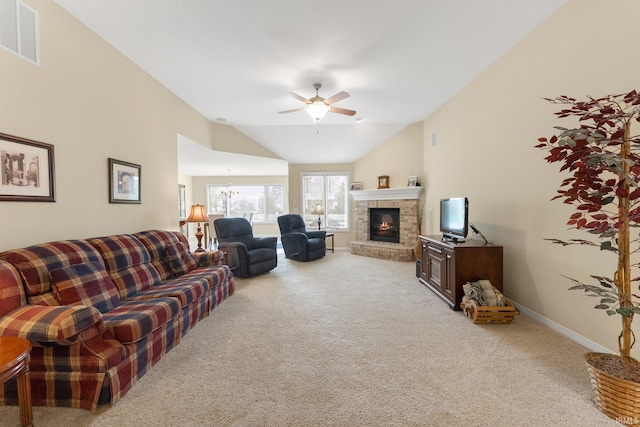 living area featuring a ceiling fan, light colored carpet, visible vents, vaulted ceiling, and a brick fireplace