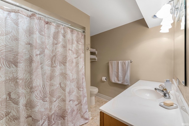 bathroom featuring vanity, tile patterned floors, toilet, and a shower with curtain