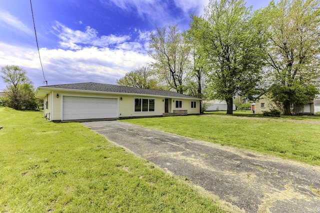 ranch-style house with a garage, driveway, and a front lawn