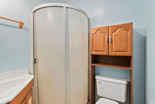 full bath with toilet, a shower stall, and vanity