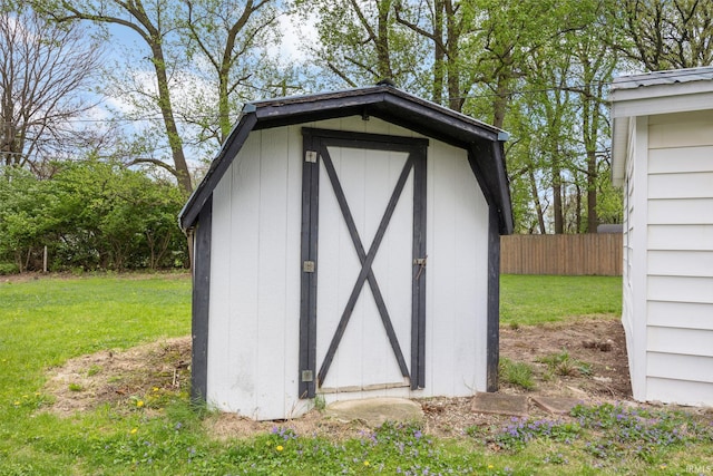 view of shed with fence