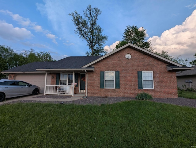 4090 Pinehurst Dr, Jasper, IN 47546 - ranch-style home with brick siding, a porch, an attached garage, and a front yard