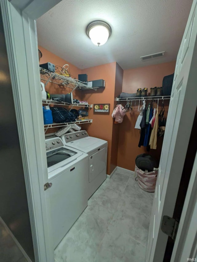 4090 Pinehurst Dr, Jasper, IN 47546 - laundry room with washer and clothes dryer and a textured ceiling