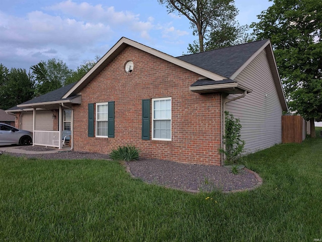 4090 Pinehurst Dr, Jasper, IN 47546 - view of property exterior featuring brick siding, an attached garage, and roof with shingles