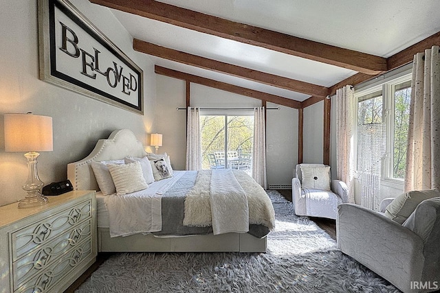 55960 County Road 23, Bristol, IN 46507 - bedroom with vaulted ceiling with beams, a baseboard heating unit, and dark wood-style flooring