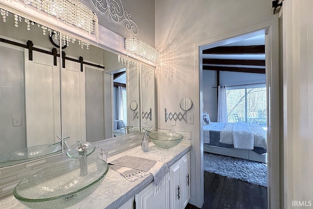 55960 County Road 23, Bristol, IN 46507 - bathroom with a sink, ensuite bathroom, and double vanity