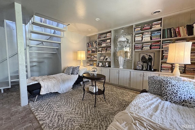 55960 County Road 23, Bristol, IN 46507 - bedroom featuring visible vents and brick floor