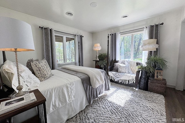 55960 County Road 23, Bristol, IN 46507 - bedroom featuring baseboards, wood finished floors, and visible vents