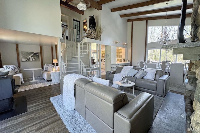 55960 County Road 23, Bristol, IN 46507 - living area with stairs, a towering ceiling, wood finished floors, beamed ceiling, and a notable chandelier
