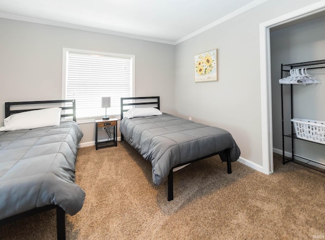 bedroom featuring baseboards, ornamental molding, and carpet flooring