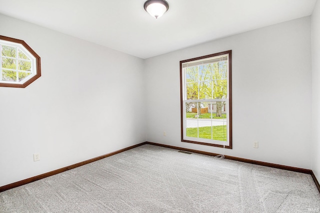 300 E Wabash Ave, Wakarusa, IN 46573 - carpeted spare room with baseboards and visible vents
