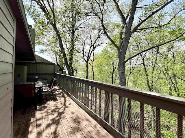 deck with outdoor dining area
