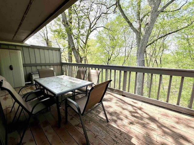 wooden deck with outdoor dining area