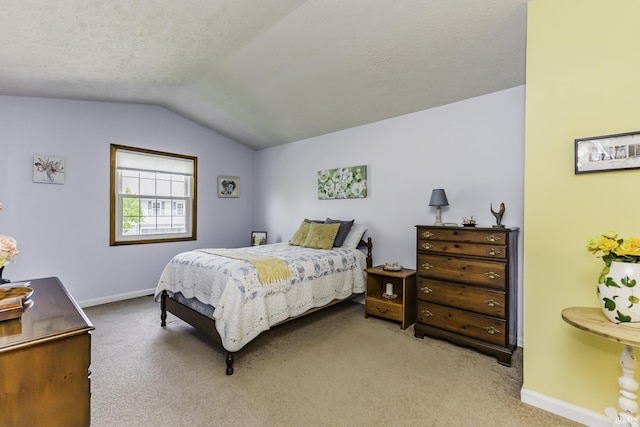 carpeted bedroom with a textured ceiling, baseboards, and lofted ceiling