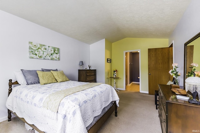 bedroom featuring a textured ceiling, baseboards, light colored carpet, and vaulted ceiling