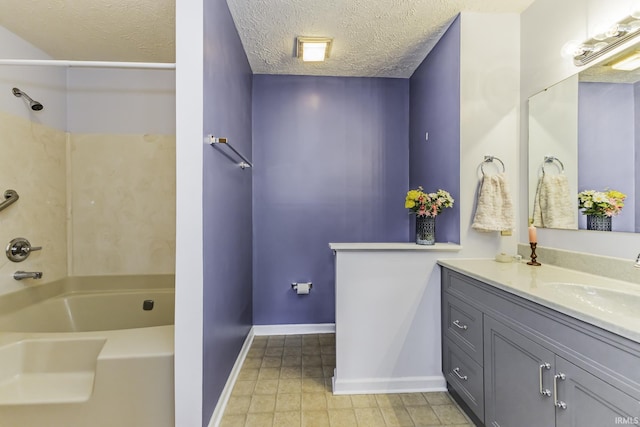 bathroom with shower / bathing tub combination, a textured ceiling, tile patterned flooring, baseboards, and vanity