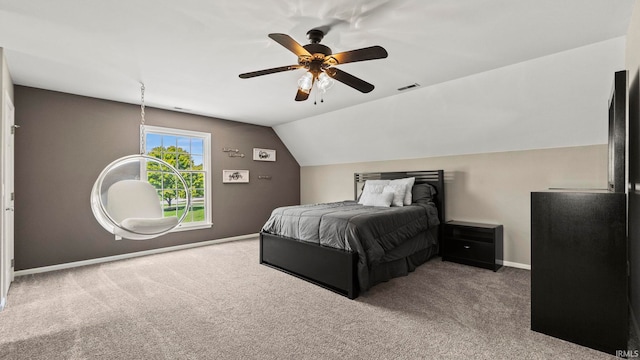 carpeted bedroom with baseboards, a ceiling fan, lofted ceiling, and visible vents