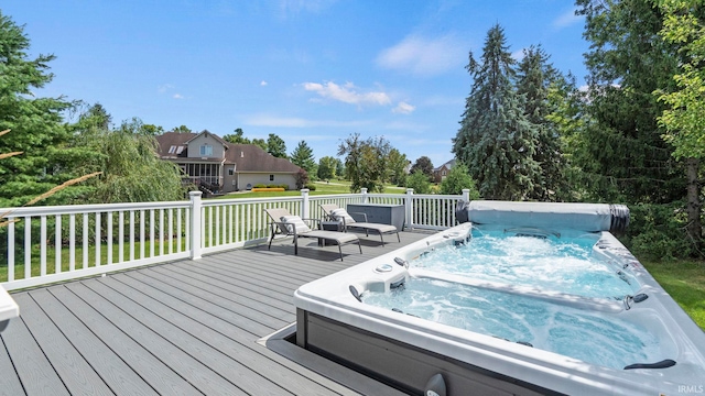 wooden terrace featuring hot tub deck surround