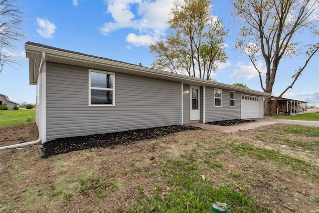 view of front of home with an attached garage and driveway