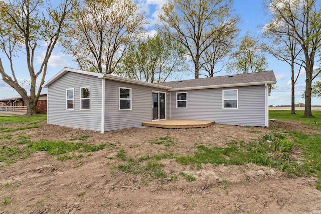 rear view of house featuring a deck