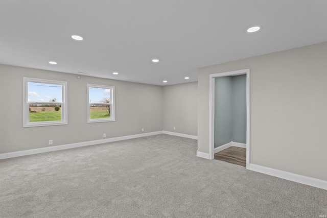 below grade area featuring recessed lighting, carpet flooring, and baseboards